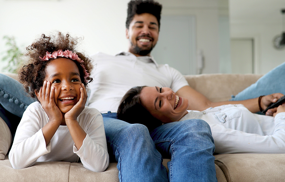 Family relaxing on couch